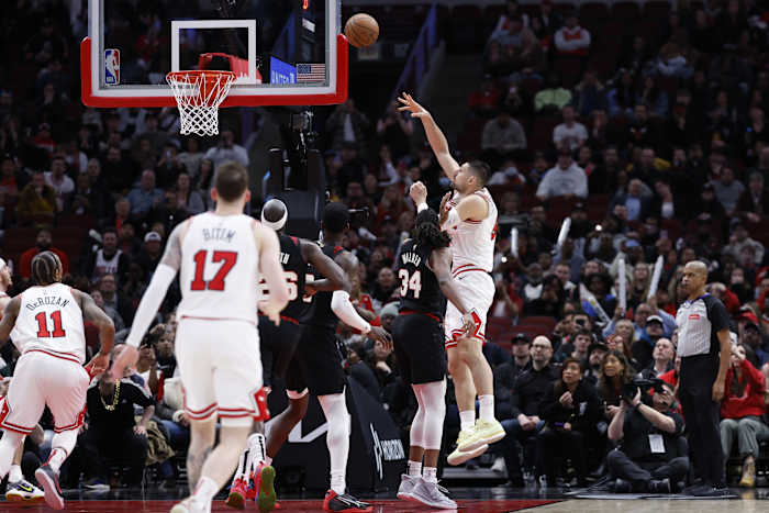 Chicago Bulls center Nikola Vucevic (9) shoots and scores against the Portland Trail Blazers during the second half at United Center.